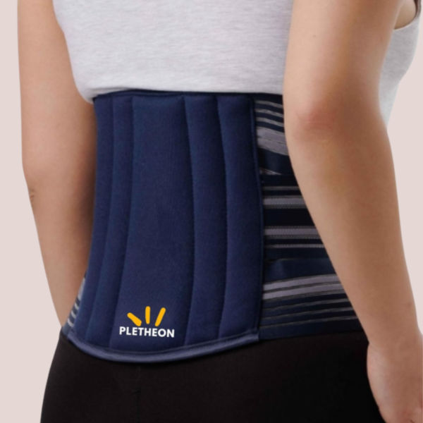 Woman wearing PLETHEON lumbar support belt providing lower back support and pain relief