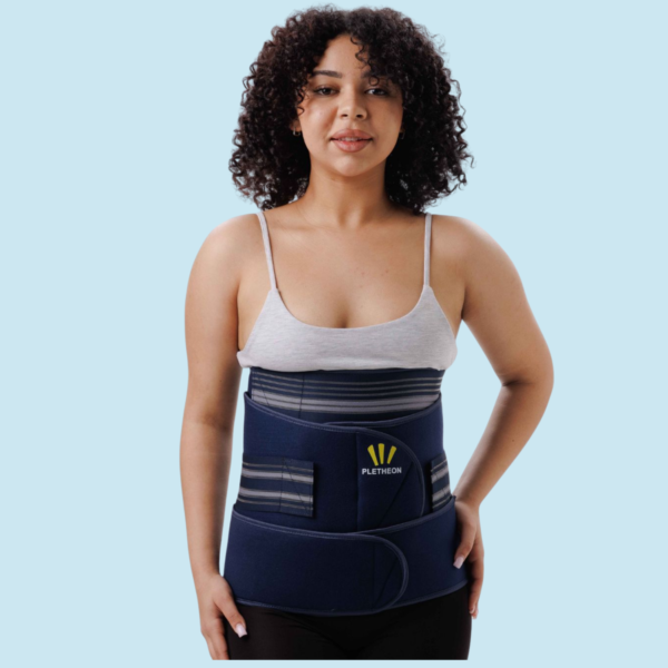 Woman wearing 3-in-1 postpartum abdominal belt for post pregnancy belly and waist support