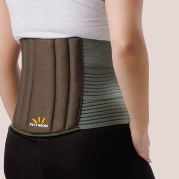 Woman wearing PLETHEON lumbar support belt providing lower back support and pain relief