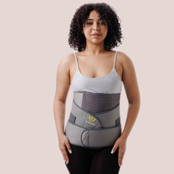 Woman wearing 3-in-1 postpartum abdominal belt for post pregnancy belly and waist support