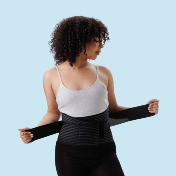 Woman wearing PLETHEON lumbar support belt providing lower back support and pain relief